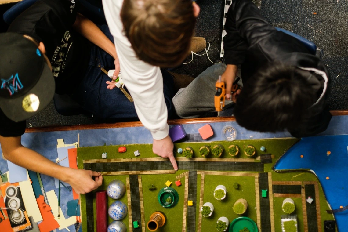 Students pointing at a 3D map